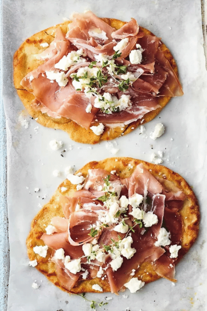 Keto Flatbread Recipe That Will Make You Forget Store-Bought Bread 3 Freshly baked keto flatbread on a rustic wooden board with garlic butter and herbs