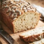 Low carb almond flour bread with sunflower seeds on a cutting board